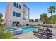 Inviting pool and spa with lounge chairs; modern design at 2 4Th Ave, Indian Rocks Beach, FL 33785