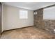 Cozy bedroom with stone accent wall and neutral carpeting at 4822 3Rd S Ave, St Petersburg, FL 33711