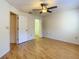 Bedroom featuring a ceiling fan and hardwood floors at 1171 Clays Trl, Oldsmar, FL 34677