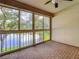 Screened patio overlooking a tranquil lake at 1171 Clays Trl, Oldsmar, FL 34677