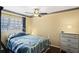 Charming bedroom with a white metal bed frame at 12912 Willoughby Ln, Hudson, FL 34667