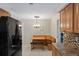 Cozy breakfast nook with wood table and built-in bench seating at 12912 Willoughby Ln, Hudson, FL 34667