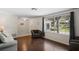 Living room featuring hardwood floors and access to the front at 12912 Willoughby Ln, Hudson, FL 34667