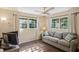 Home office featuring a sofa and large window at 12912 Willoughby Ln, Hudson, FL 34667