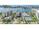 Aerial view of waterfront community, tennis courts, and pool at 660 Island Way # 401, Clearwater, FL 33767