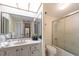 Clean bathroom with a tub shower combo and updated vanity at 660 Island Way # 401, Clearwater, FL 33767