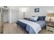 Comfortable bedroom with a king-size bed and dresser at 660 Island Way # 401, Clearwater, FL 33767