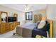 Bright bedroom with a king-size bed and ample dresser space at 660 Island Way # 401, Clearwater, FL 33767