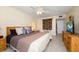 Spacious Primary bedroom with king-size bed and ceiling fan at 660 Island Way # 401, Clearwater, FL 33767