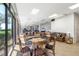 Common area with seating, a card table, and large windows at 660 Island Way # 401, Clearwater, FL 33767