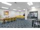 Spacious community room with tables and chairs for gatherings at 660 Island Way # 401, Clearwater, FL 33767