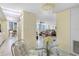 Dining area with glass table and view into the living room at 660 Island Way # 401, Clearwater, FL 33767