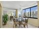 Bright dining area with glass table and water views at 660 Island Way # 401, Clearwater, FL 33767
