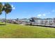 Community boat dock with multiple boats and a grassy area at 660 Island Way # 401, Clearwater, FL 33767