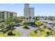 Building exterior showcasing landscaping and parking at 660 Island Way # 401, Clearwater, FL 33767