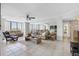 Bright living room with tiled floors, comfortable seating, and large windows at 660 Island Way # 401, Clearwater, FL 33767