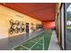 Community recreation room with seating, TV, and shuffleboard at 660 Island Way # 401, Clearwater, FL 33767