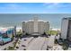 Aerial view of the beachfront condo with ample parking and amazing beachfront access at 7000 Beach Plz # 505, St Pete Beach, FL 33706