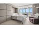Bedroom with large windows and ceiling fan at 7000 Beach Plz # 505, St Pete Beach, FL 33706