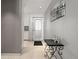 A hallway leading to the front door with art on the wall at 7000 Beach Plz # 505, St Pete Beach, FL 33706