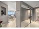 Hallway with a mirrored closet that offers views of the beach and nearby bathroom at 7000 Beach Plz # 505, St Pete Beach, FL 33706