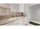 Bright kitchen featuring white cabinetry, stainless steel fixtures, and neutral countertops at 7000 Beach Plz # 505, St Pete Beach, FL 33706