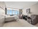Bright bedroom featuring tile floors, built-in storage and captivating ocean views, creating a serene living space at 7000 Beach Plz # 505, St Pete Beach, FL 33706
