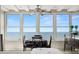 Dining area featuring ocean view and a ceiling fan at 7000 Beach Plz # 505, St Pete Beach, FL 33706