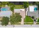 Aerial perspective showcasing three homes with pools and lush landscaping at 6087 16Th Ne Ln, St Petersburg, FL 33703