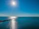 Aerial shot of bridge over water with bright sunlight at 300 Woodette Dr # 202B, Dunedin, FL 34698