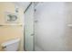Bright bathroom with shower stall and toilet at 300 Woodette Dr # 202B, Dunedin, FL 34698