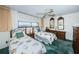 Guest bedroom with twin beds and built-in dresser at 300 Woodette Dr # 202B, Dunedin, FL 34698