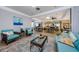 Relaxing common area with seating, tables, and a fireplace at 300 Woodette Dr # 202B, Dunedin, FL 34698