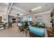 Spacious common area with comfortable seating and a Christmas tree at 300 Woodette Dr # 202B, Dunedin, FL 34698