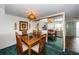 Dining area with wood table and mirrored wall at 300 Woodette Dr # 202B, Dunedin, FL 34698