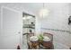 Bright dining area adjacent to the kitchen at 300 Woodette Dr # 202B, Dunedin, FL 34698