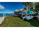 Outdoor kayak and paddleboard storage area at 300 Woodette Dr # 202B, Dunedin, FL 34698