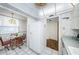 White kitchen with breakfast nook and fridge at 300 Woodette Dr # 202B, Dunedin, FL 34698