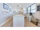 Well-equipped kitchen with white cabinets and marble counters at 300 Woodette Dr # 202B, Dunedin, FL 34698