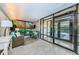 Comfortable lobby with seating area and glass doors at 300 Woodette Dr # 202B, Dunedin, FL 34698