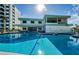 Inviting outdoor swimming pool with surrounding patio at 300 Woodette Dr # 202B, Dunedin, FL 34698