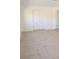 Bedroom with large closet and neutral-toned tile flooring at 1800 Montana Ne Ave, St Petersburg, FL 33703