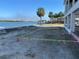 Backyard view showing the home's layout marked off with tape and pylons next to the water at 2121 Bayou Grande Ne Blvd, St Petersburg, FL 33703