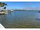 Tranquil waterfront view with a dock, and clear, calm water at 2121 Bayou Grande Ne Blvd, St Petersburg, FL 33703