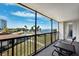 Spacious balcony overlooks the water and pool area at 100 Oakmont Ln # 301, Belleair, FL 33756