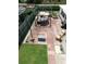 Aerial view of a backyard featuring a large patio, gazebo, and landscaped areas at 1172 Chelsea Ln, Holiday, FL 34691