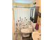 Bright bathroom featuring patterned shower curtain and tiled walls at 1172 Chelsea Ln, Holiday, FL 34691