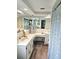 Spacious bathroom with double sinks, a vanity area, and stylish decor, creating a comfortable and functional space at 1172 Chelsea Ln, Holiday, FL 34691