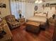 Comfortable bedroom with a ceiling fan, nightstands, and a spacious woven chest at 1172 Chelsea Ln, Holiday, FL 34691