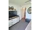 Well-lit bedroom features a large window, TV, and storage cabinet, providing both comfort and convenience at 1172 Chelsea Ln, Holiday, FL 34691